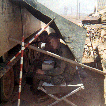 aiming sticks holding tarp